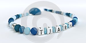 A blue pacifier chain for boys with name Tjark