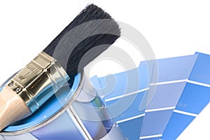 color swatches, a can of paint and a paintbrush