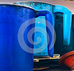 Blue paint mugs on the table