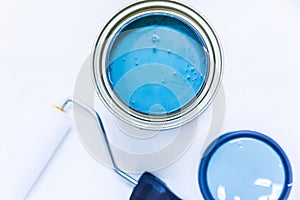 Blue paint and roller home improvement