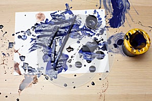 blue paint spilled on paper