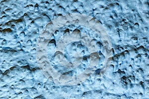 Blue painted background  blue textured wall. Artistic plaster. Abstract pattern