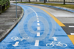 blue painted road bike lane cycling bicycle