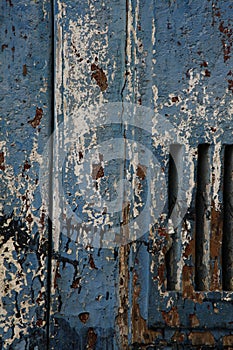 Blue painted textured wood door detail