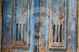 Blue painted textured wood door detail