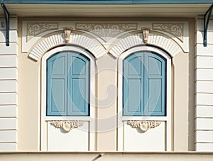 Blue painted wood arched windows photo