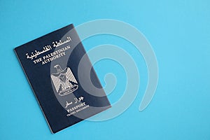 Blue Palestinian Authority passport on blue background close up