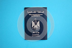 Blue Palestinian Authority passport on blue background close up