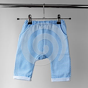 Blue panties for the baby. The concept of clothes, motherhood and newborn photo