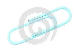 Blue paper clip on a white background, isolate. Top view, flat lay