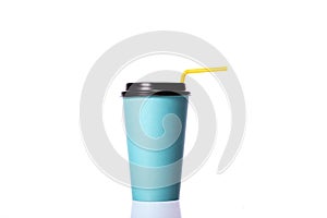 Blue paper coffee cup with yellow plastic straw isolated on white background