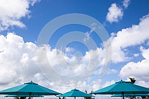 Blue parasols with blue sky background in a sunny day