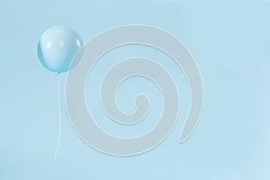 Blue pastel balloon on minimalist background