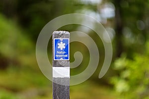 Blue path marker of a nature preserve