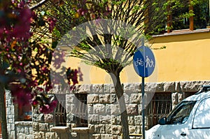 Blue pedestrian crossing and bicycle path street sign