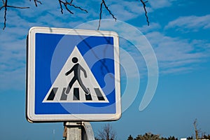 blue pedestrian crossing sign