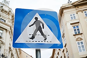 Blue pedestrian sign in Vienna, Austria