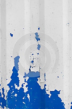 Blue peeling old paint metal surface fence texture background white flakes