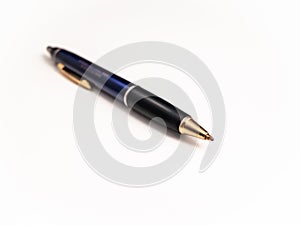 Blue pen with shallow depth of field isolated against white background