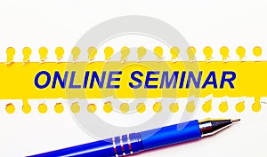 Blue pen and white torn paper stripes on a bright yellow background with the text ONLINE SEMINAR