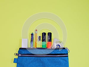 Blue pencil case with accessories.