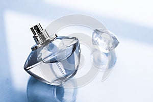 Blue perfume bottle on glossy background, sweet floral scent, glamour fragrance and eau de parfum as holiday gift and luxury