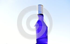 Blue perfume bottle isolated on a white background