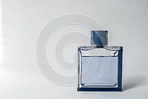 Blue perfume bottle on a white background