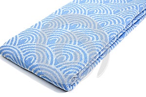 Blue Peshtemal Turkish towel folded colorful textile for spa, beach, pool, light travel, healthy fashion and gifts. Traditional