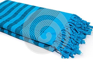 Blue Peshtemal Turkish towel folded colorful textile for spa, beach, pool, light travel, healthy fashion and gifts. Traditional tu