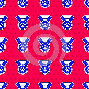 Blue Pet award symbol icon isolated seamless pattern on red background. Badge with dog or cat paw print and ribbons