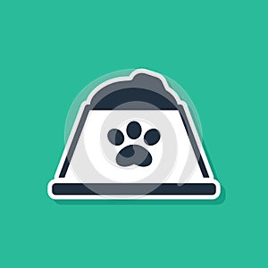 Blue Pet food bowl for cat or dog icon isolated on green background. Dog or cat paw print. Vector