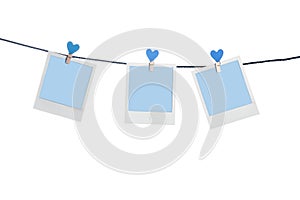 Blue photoframes with blue heart clothepins