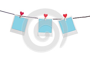 Blue photoframes with red heart clothepins photo