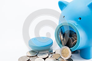 Blue piggy bank crying when opened to get coins photo