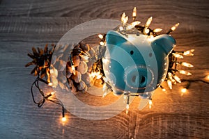 Blue piggy bank with party light, planning a party for the event where successful in saving money for use in various festivals
