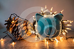 Blue piggy bank with party light, planning a party for the event where successful in saving money for use in various festivals