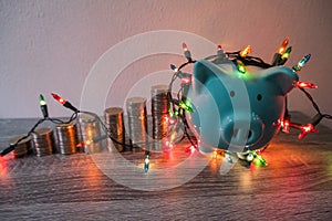 Blue piggy bank with party light, planning a party for the event where successful in saving money for use in various festivals