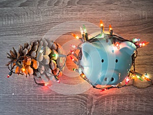 Blue piggy bank and pinecone with Party lights, Enjoy savings for the holidays concept