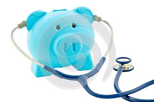 Blue piggy bank with stethoscope isolated on white background.