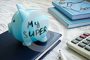 Blue piggy bank with words my super or superannuation fund. photo