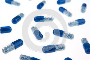 Blue pills isolated on white