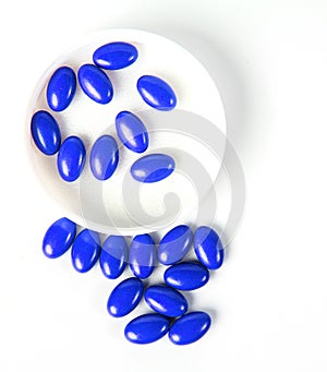 Blue pills isolated on white - plls background