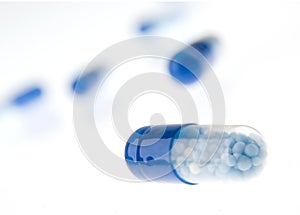 Blue pills isolated on white