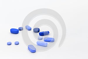 Blue pills for male impotence. Concept of erectile dysfunction in men post COVID-19. Free space to write