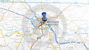 A blue pin stuck in Belgrade on a map of Serbia