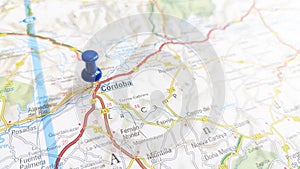 A blue pin stuck in Cordoba on a map of Spain