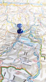 A blue pin stuck in luzern Lucerne on a map of Switzerland portrait