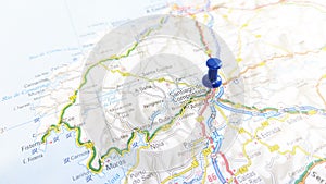 A blue pin stuck in Santiago de Compostela on a map of Spain photo