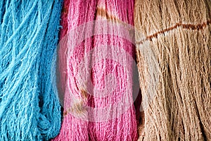 Blue, pink and brown background, Patterns colorful nature of multicolored raw cotton thread texture group